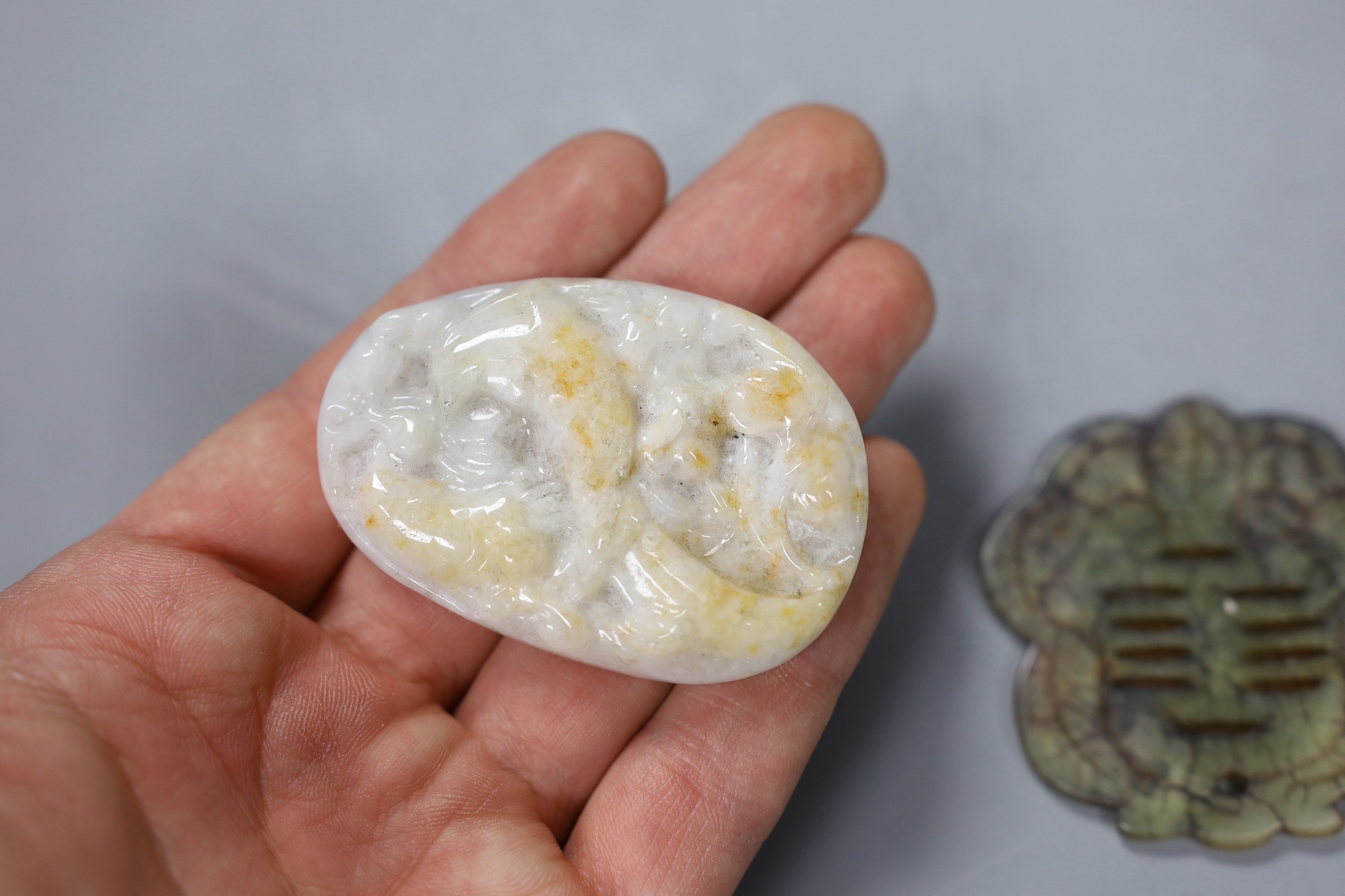 Four Chinese carved hardstone plaques, largest 5.7cm